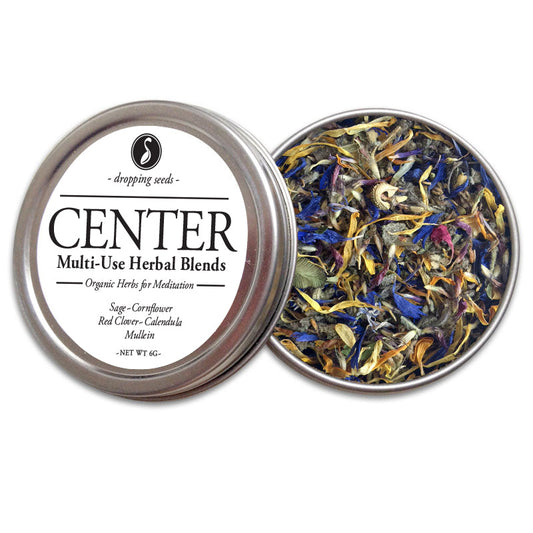 Open tin of 'CENTER' multi-use herbal blends with sage, cornflower, red clover, calendula and mullein on a white background