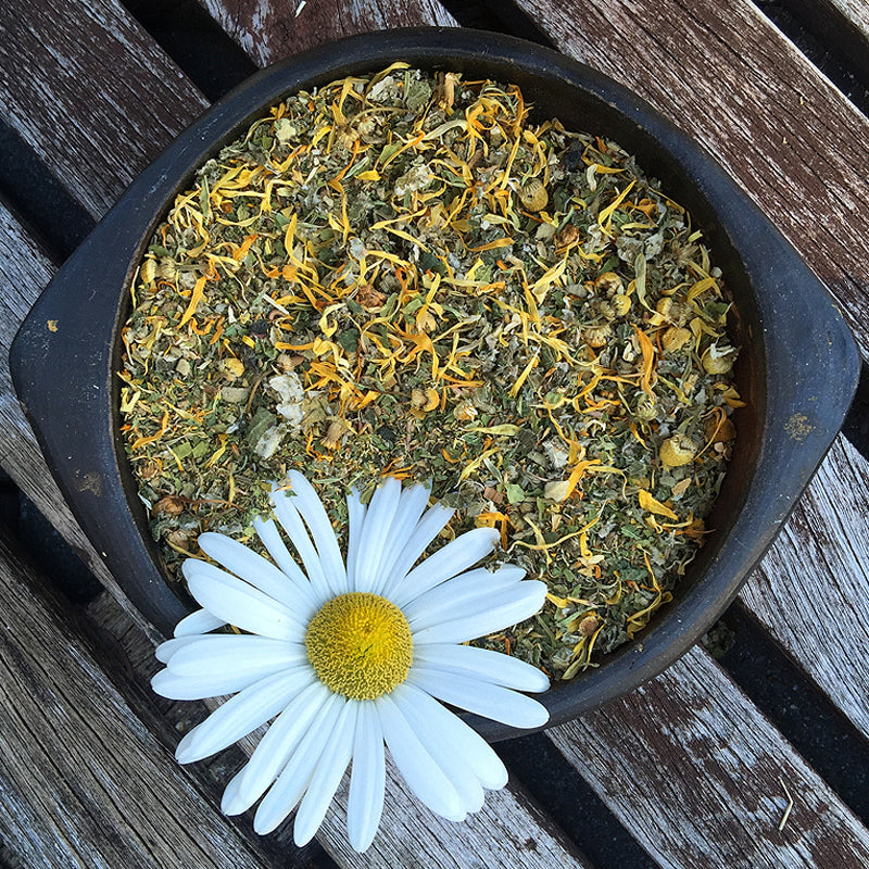 Ceramic bowl filled with yellow and green plants and a daisy flower – SUN herbal mix