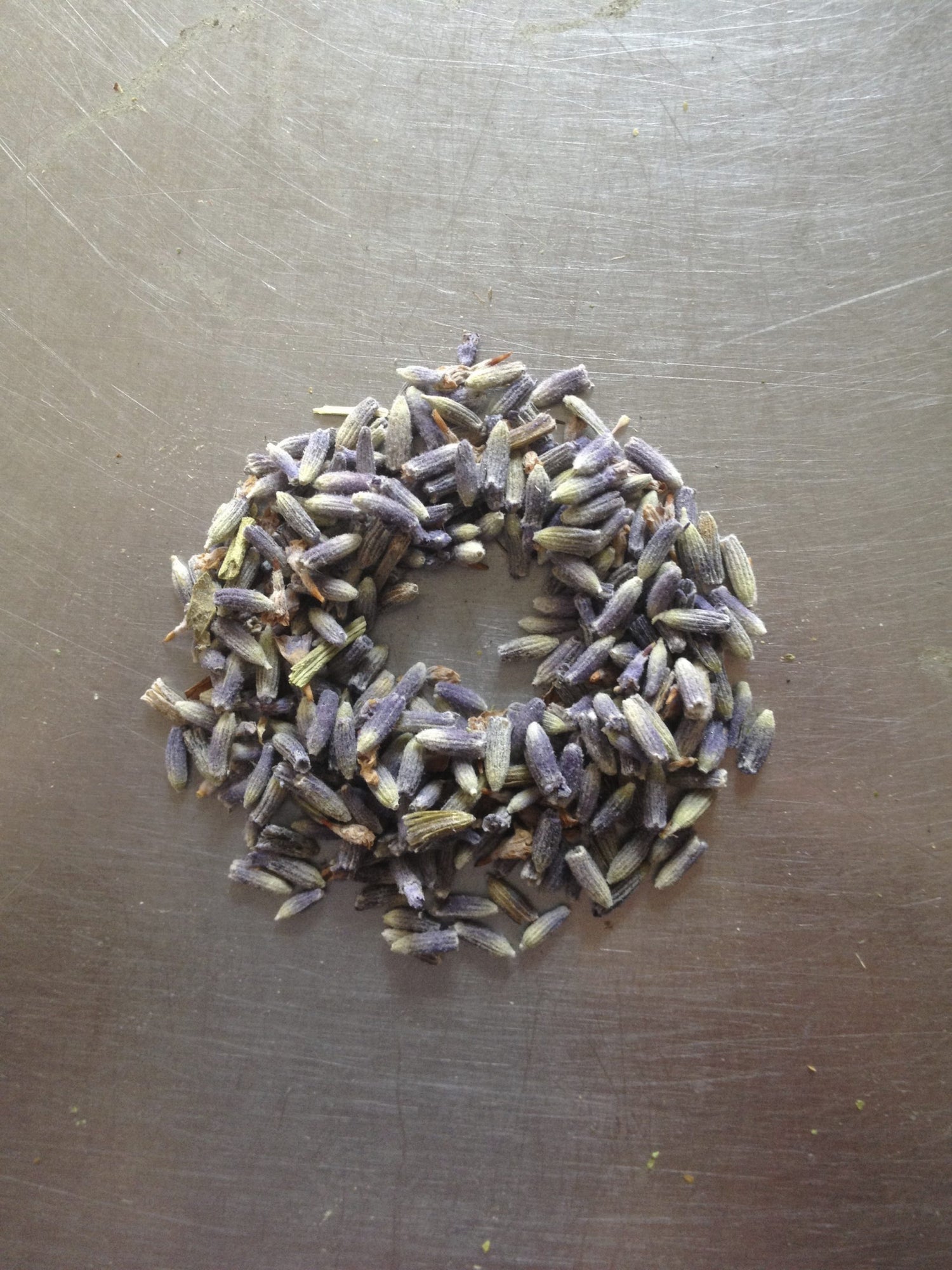 Wreath of dried lavender flowers on a metallic surface
