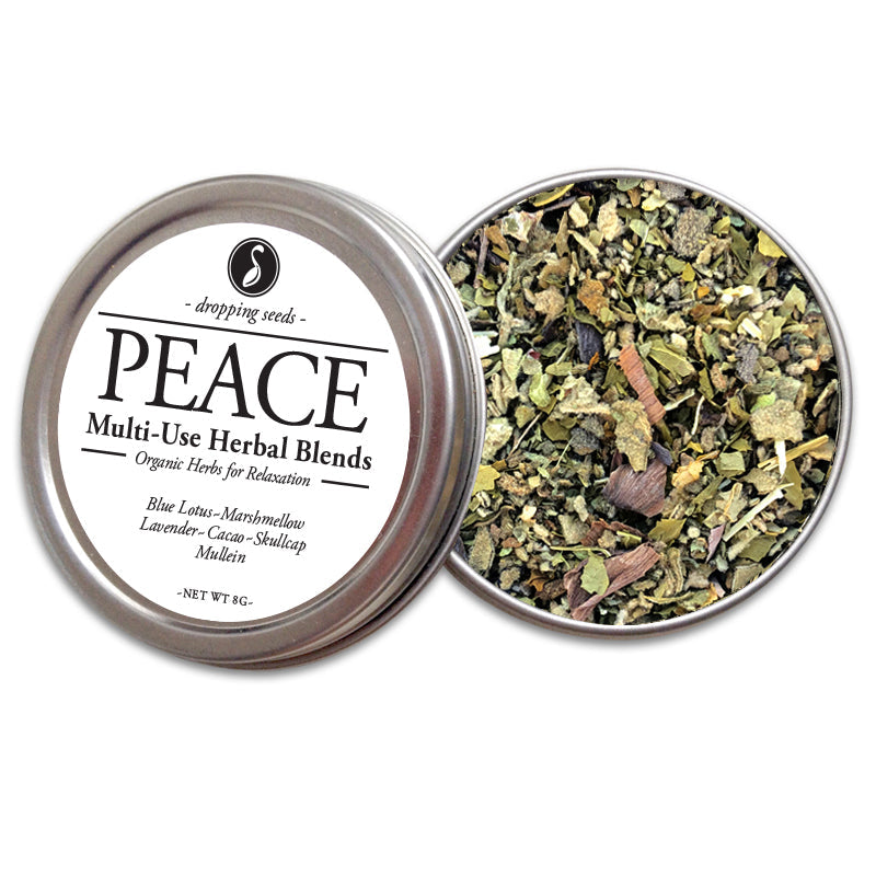 Open metal tin labeled 'Peace' with herbal blend of blue lotus, marshmellow, lavender, cacao, skullcap and mullein inside on a white background
