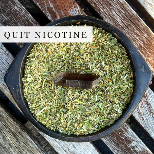 A blend of organic herbs to quit smoking in a black bowl